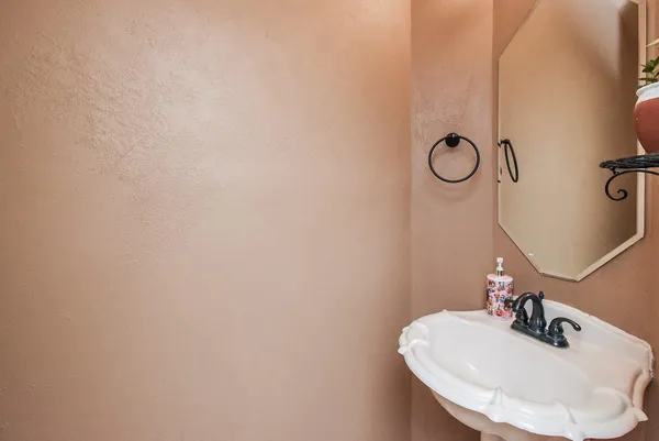 a bathroom with a sink and mirror