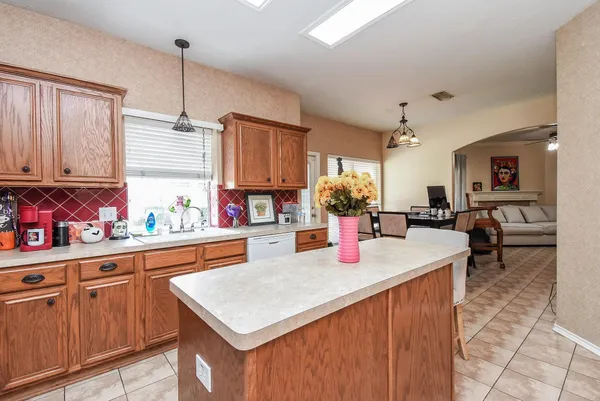 a kitchen with sink cabinets and window