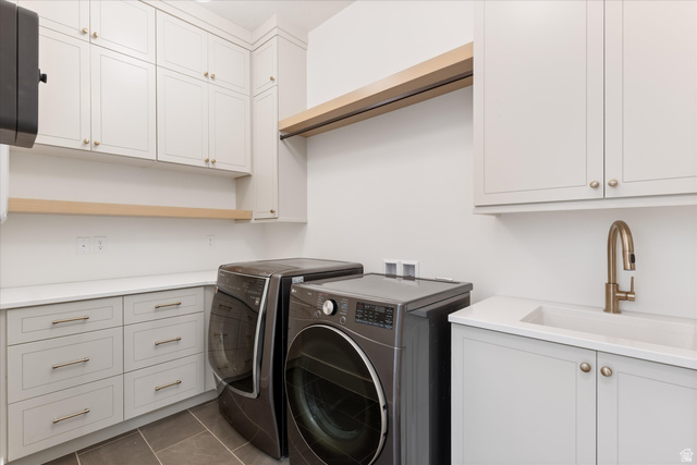 1192 East Corral Way Washington, UT 84780 - Photo 36 of 81 White shaker cabinetry with gold-tone hardware, light wood shelving, and a white countertop with an integrated sink and brushed gold-tone faucet