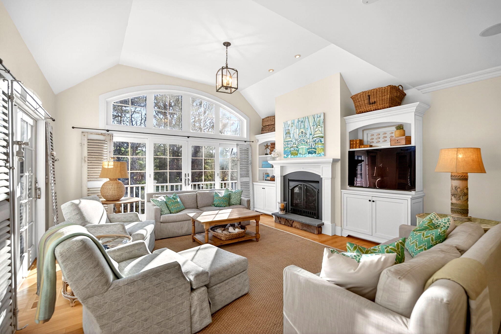 205 Little River Road Cotuit, MA 02635 - Photo 16 of 60 a living room with furniture a flat screen tv and a large window