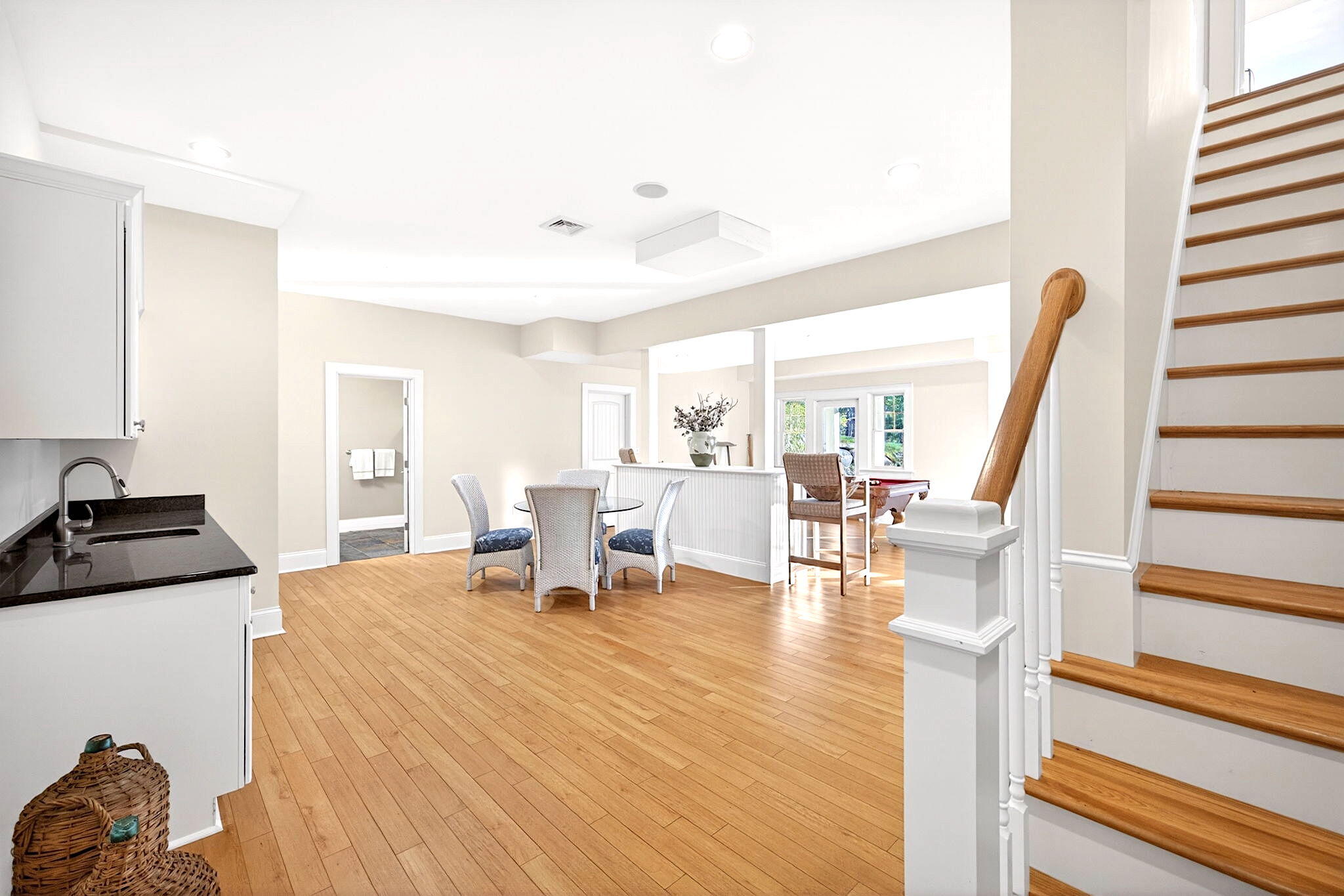 205 Little River Road Cotuit, MA 02635 - Photo 32 of 60 a living room with furniture and a table