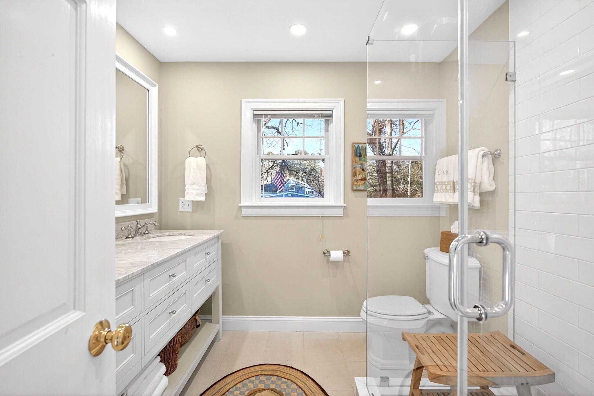 205 Little River Road Cotuit, MA 02635 - Photo 44 of 60 a bathroom with a granite countertop toilet sink and mirror