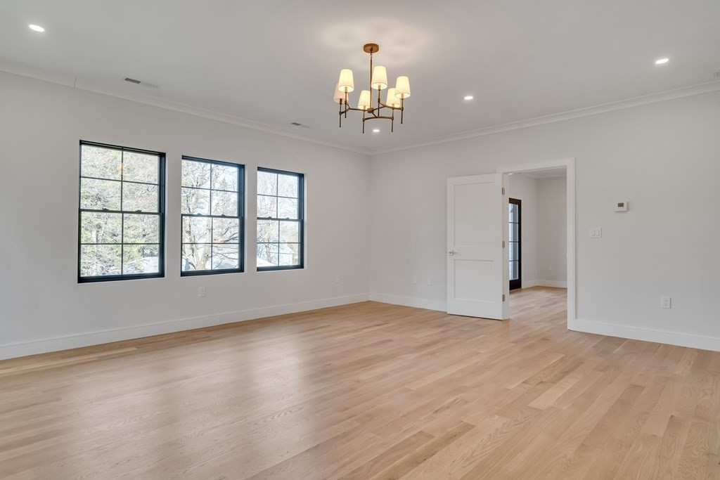 37 Preston Road Lexington, MA 02420 - Photo 14 of 27 wooden floor in an empty room with a window