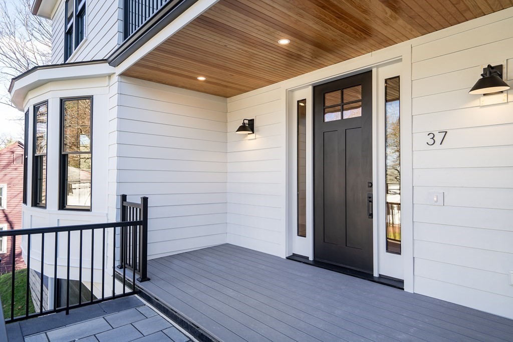 37 Preston Road Lexington, MA 02420 - Photo 2 of 27 a view of a porch with wooden floor and fence