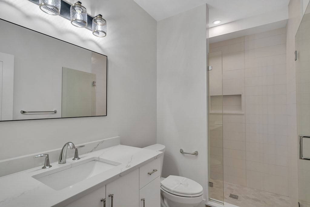 37 Preston Road Lexington, MA 02420 - Photo 21 of 27 a bathroom with a sink a toilet and shower