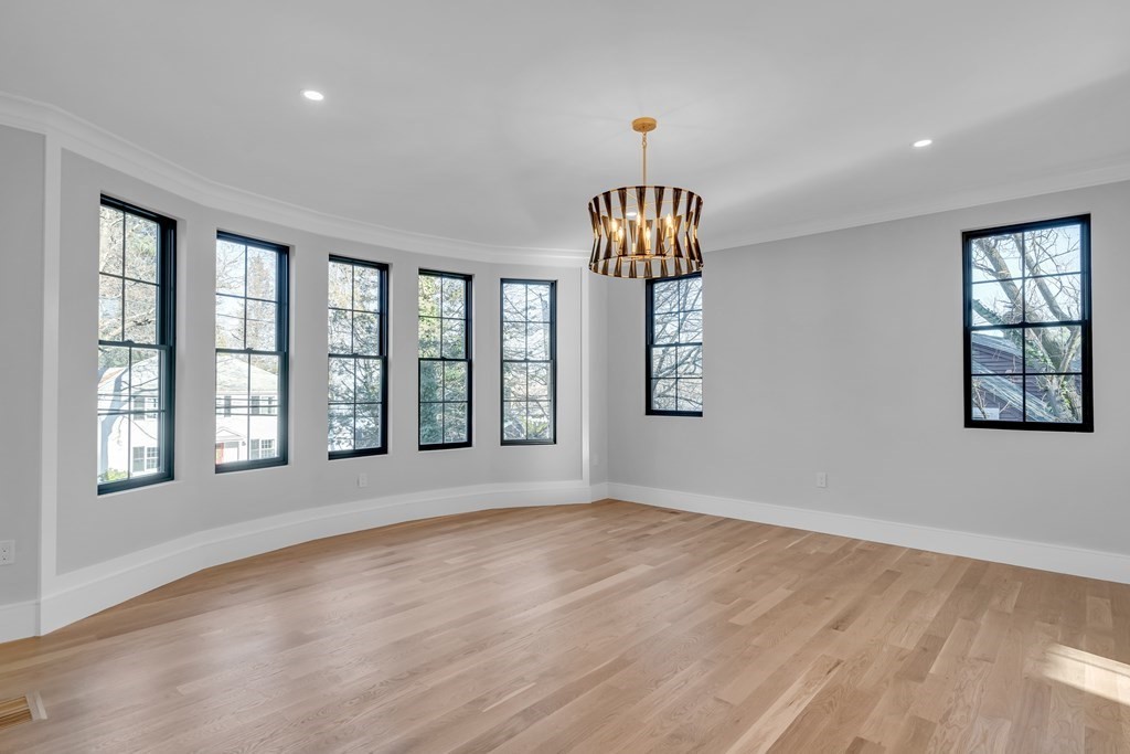 37 Preston Road Lexington, MA 02420 - Photo 5 of 27 a view of an empty room with a window and wooden floor