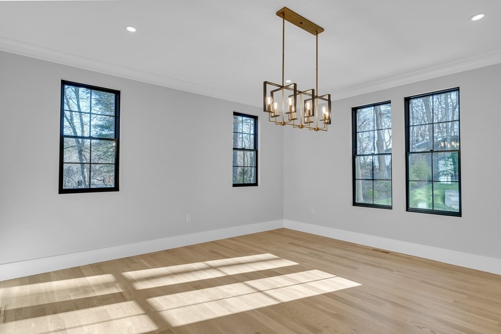 37 Preston Road Lexington, MA 02420 - Photo 7 of 27 a view of an empty room with window and hardwood floor