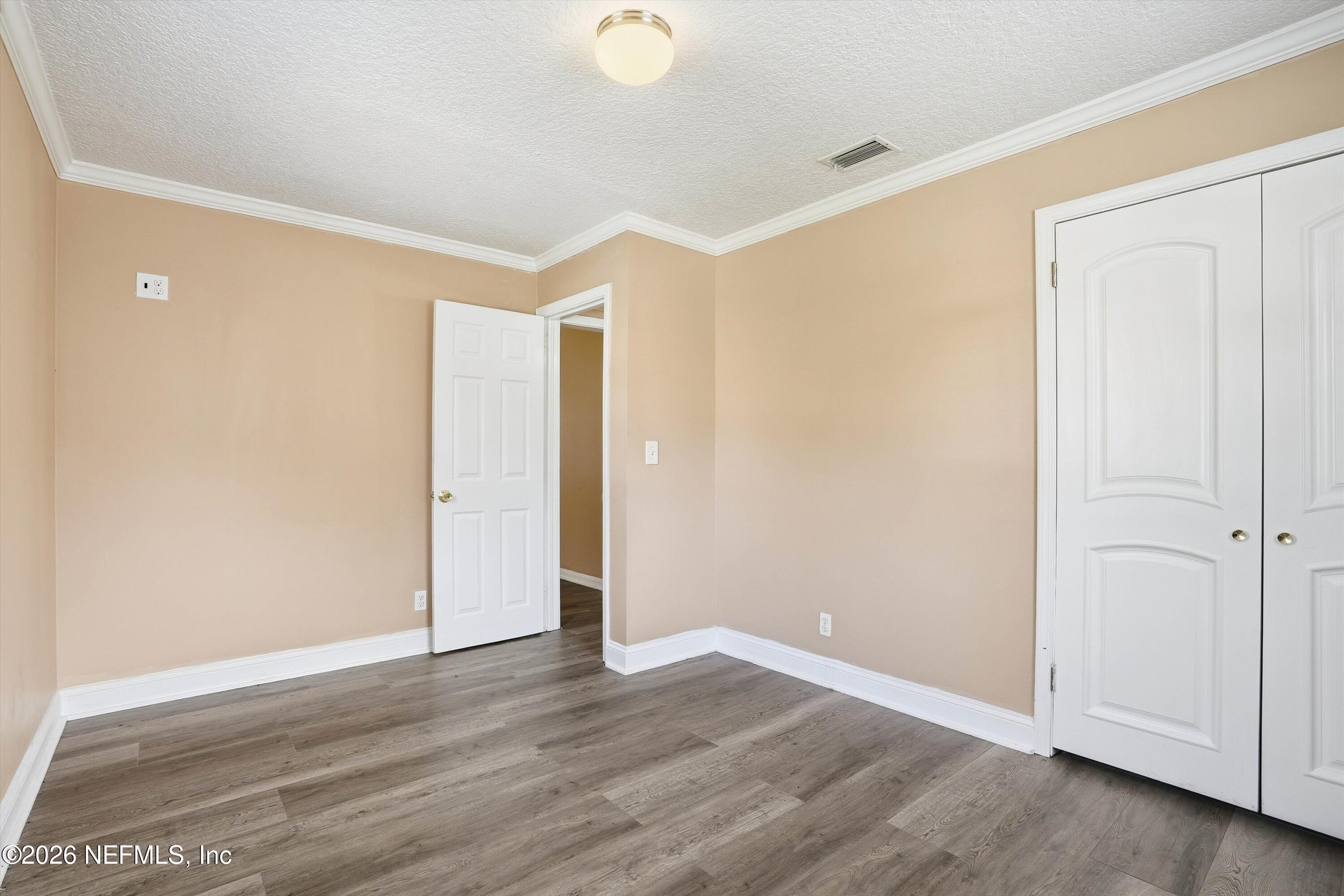 1736 Lakewood Road Jacksonville, FL 32207 - Photo 15 of 31 wooden floor in an empty room