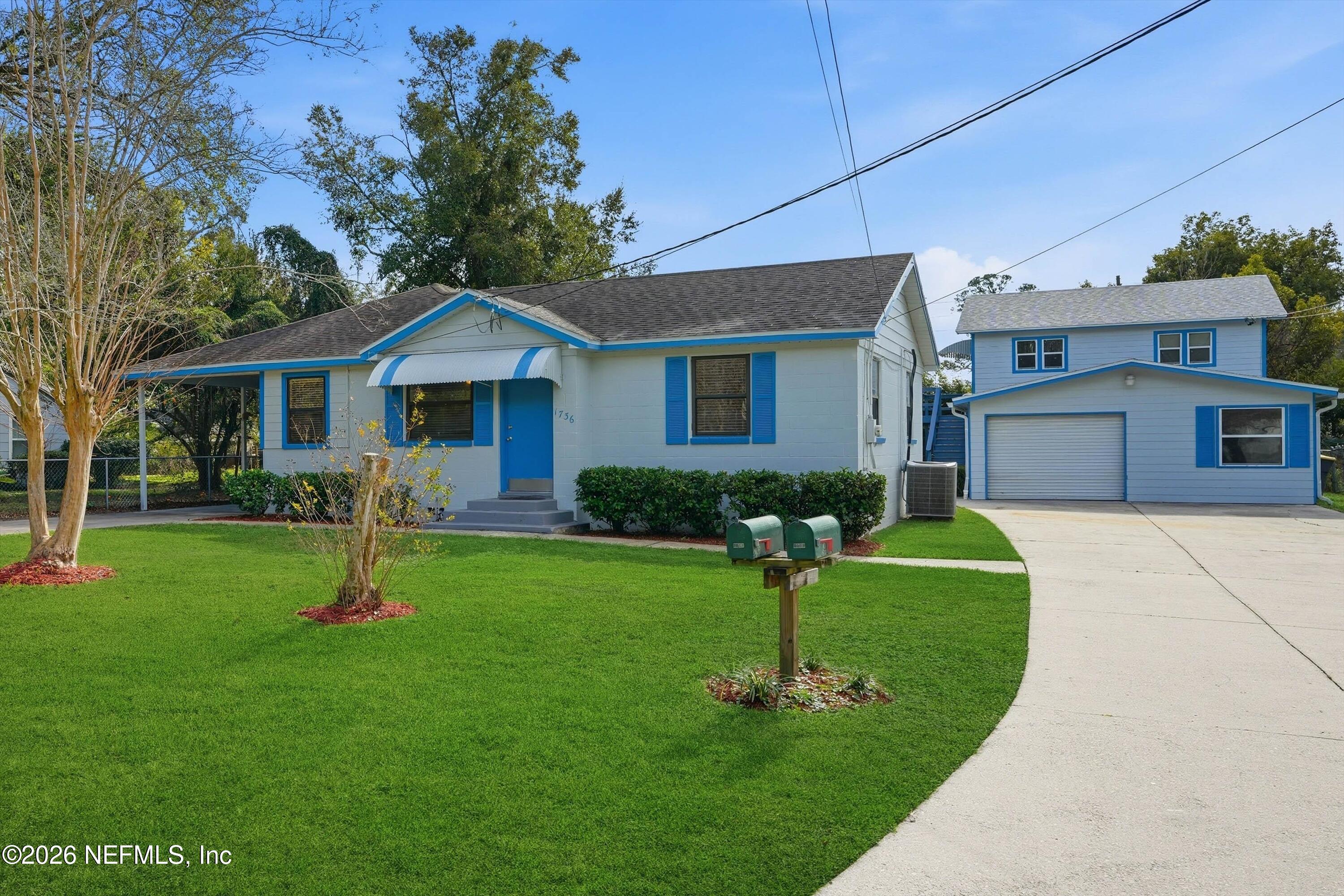 1736 Lakewood Road Jacksonville, FL 32207 - Photo 2 of 31 a front view of a house with a yard