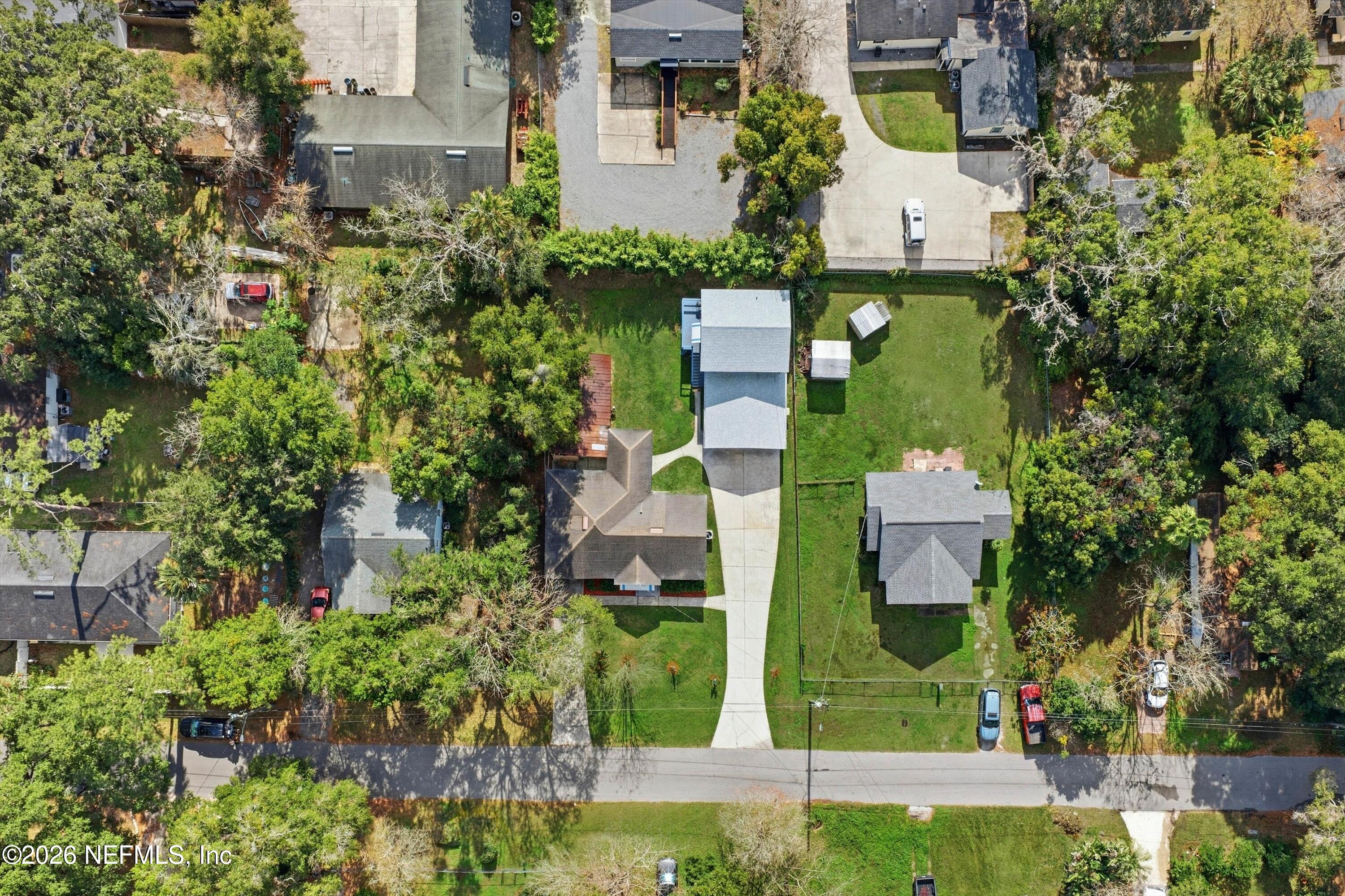 1736 Lakewood Road Jacksonville, FL 32207 - Photo 29 of 31 front view of a house with a small yard and large trees