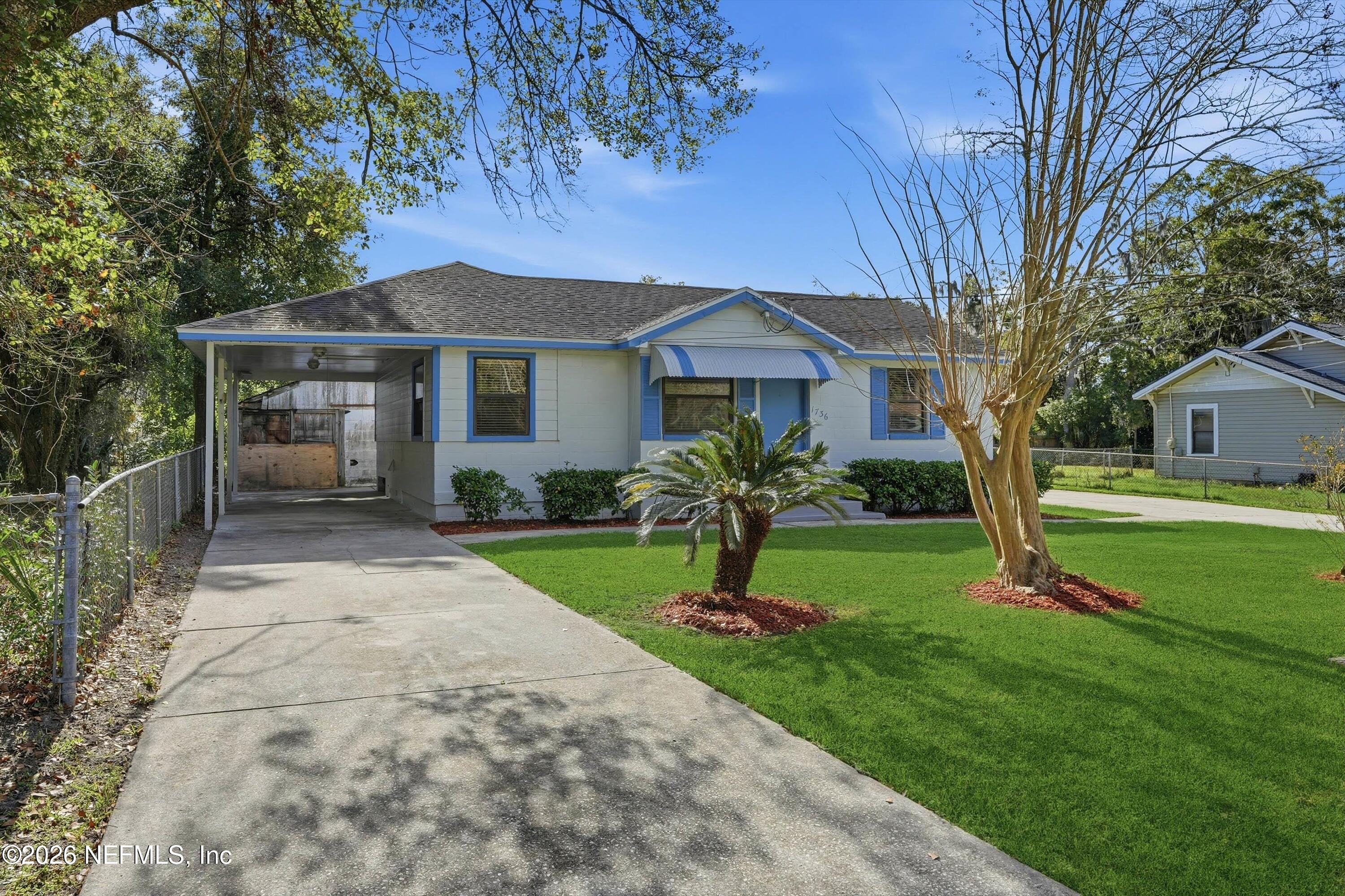 1736 Lakewood Road Jacksonville, FL 32207 - Photo 3 of 31 a front view of a house with a garden