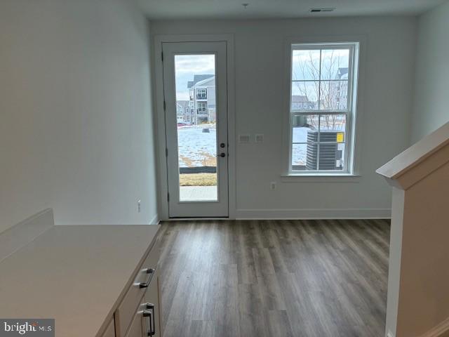 76 Valerian Loop, Unit 2 Stafford, VA 22554 - Photo 12 of 43 an empty room with wooden floor and windows