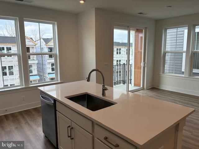 76 Valerian Loop, Unit 2 Stafford, VA 22554 - Photo 4 of 43 a kitchen with a sink a counter top space and a large window