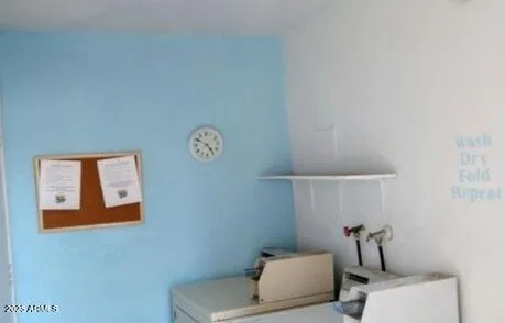 an empty room with closet and mirror