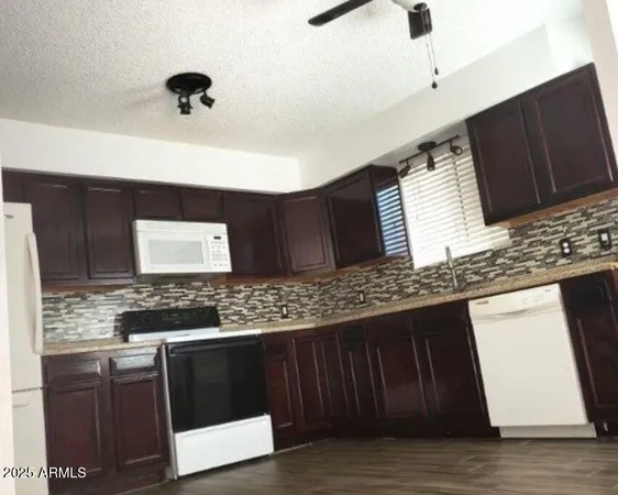 a kitchen with a sink and a stove
