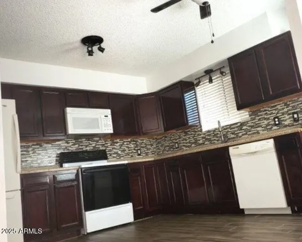 a kitchen with a sink and a stove
