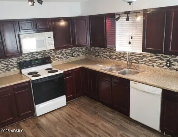 a kitchen with a sink and a window