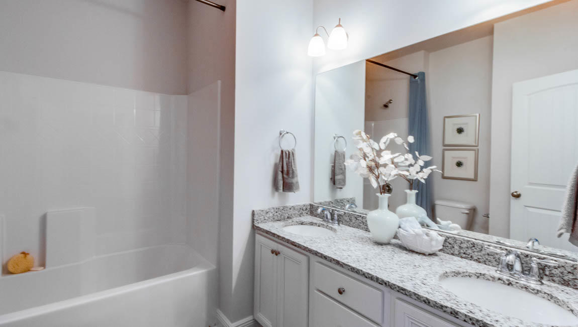 35 Krewe Circle, Unit LOT 15 Santa Rosa Beach, FL 32459 - Photo 18 of 23 a bathroom with a granite countertop sink and a mirror