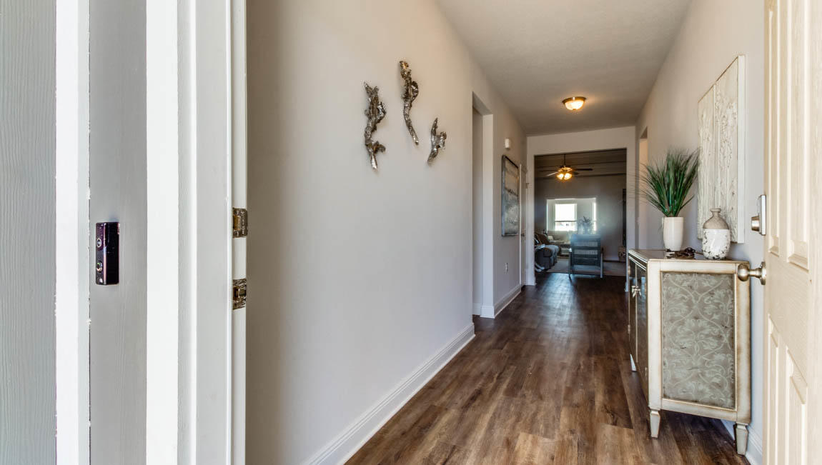 35 Krewe Circle, Unit LOT 15 Santa Rosa Beach, FL 32459 - Photo 3 of 23 a view of a hallway with wooden floor staircase and living room