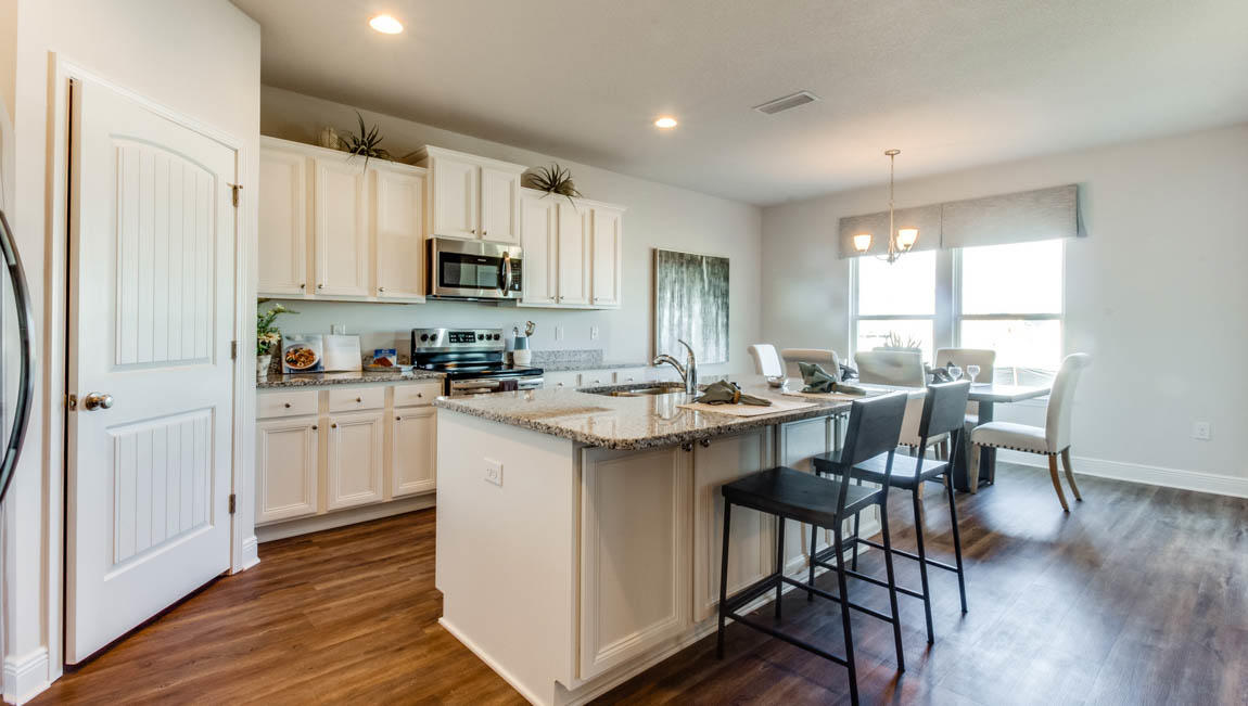 35 Krewe Circle, Unit LOT 15 Santa Rosa Beach, FL 32459 - Photo 6 of 23 a kitchen with microwave a sink and cabinets