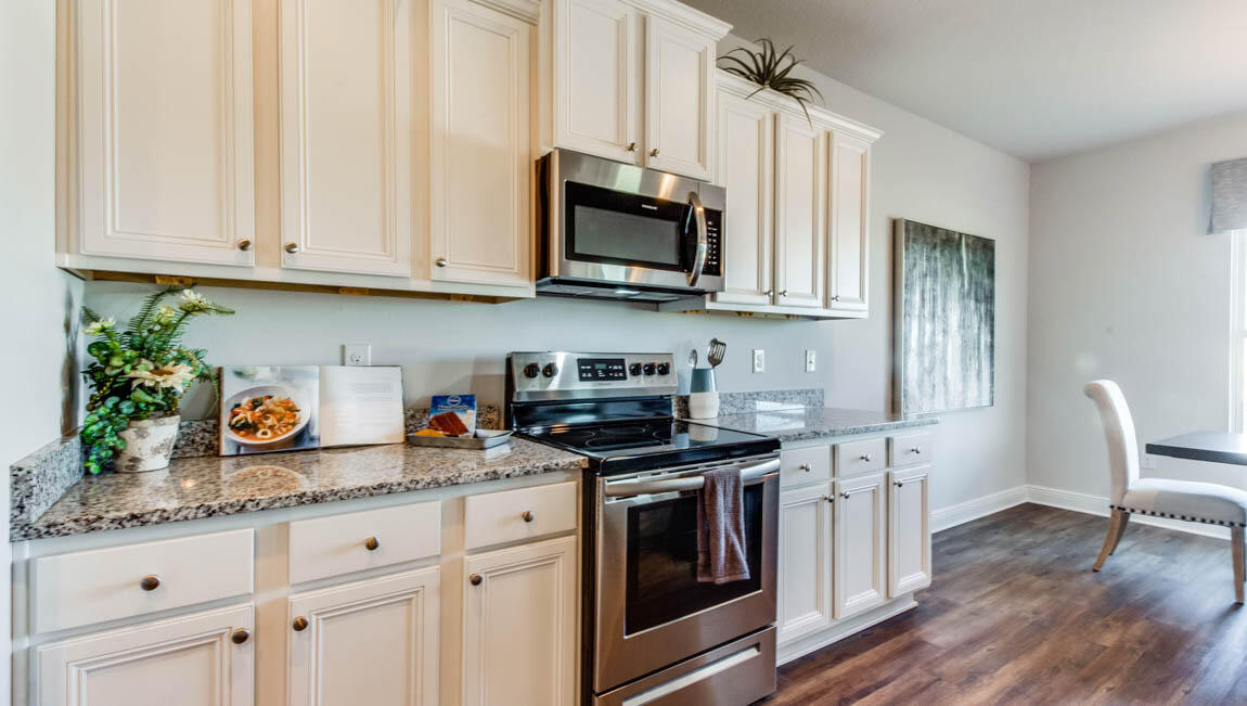 35 Krewe Circle, Unit LOT 15 Santa Rosa Beach, FL 32459 - Photo 8 of 23 a kitchen with stainless steel appliances granite countertop a stove a sink and a microwave