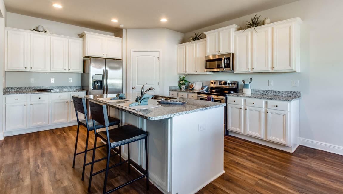 35 Krewe Circle, Unit LOT 15 Santa Rosa Beach, FL 32459 - Photo 9 of 23 a kitchen with stainless steel appliances granite countertop a stove top oven a refrigerator a sink and dishwasher with wooden floor