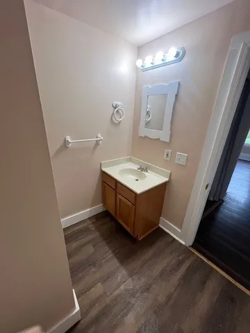 a spacious bathroom with a sink and a mirror