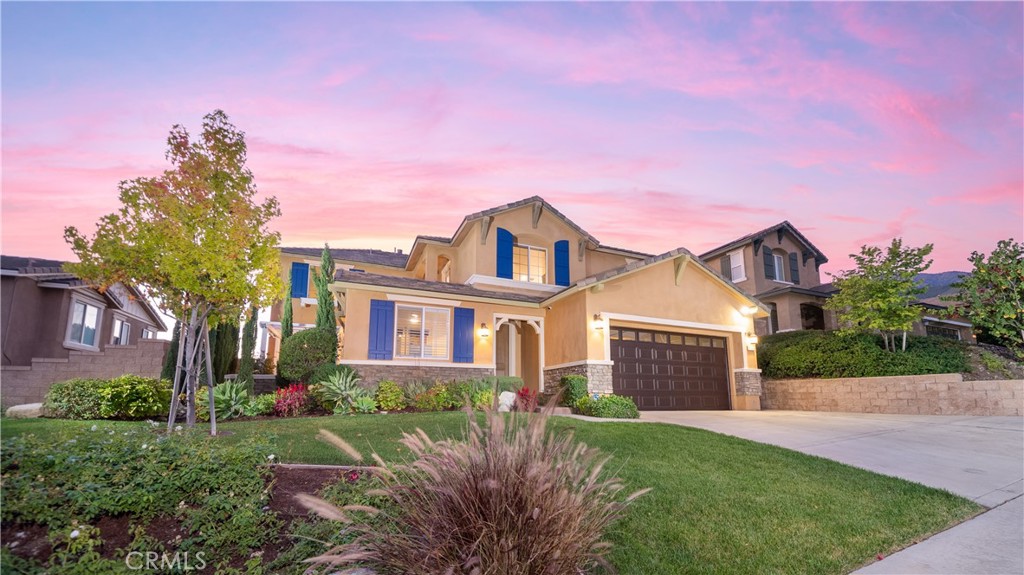 5142 Crimson Place Rancho Cucamonga, CA 91739 - Photo 1 of 1 a front view of a house with yard and green space