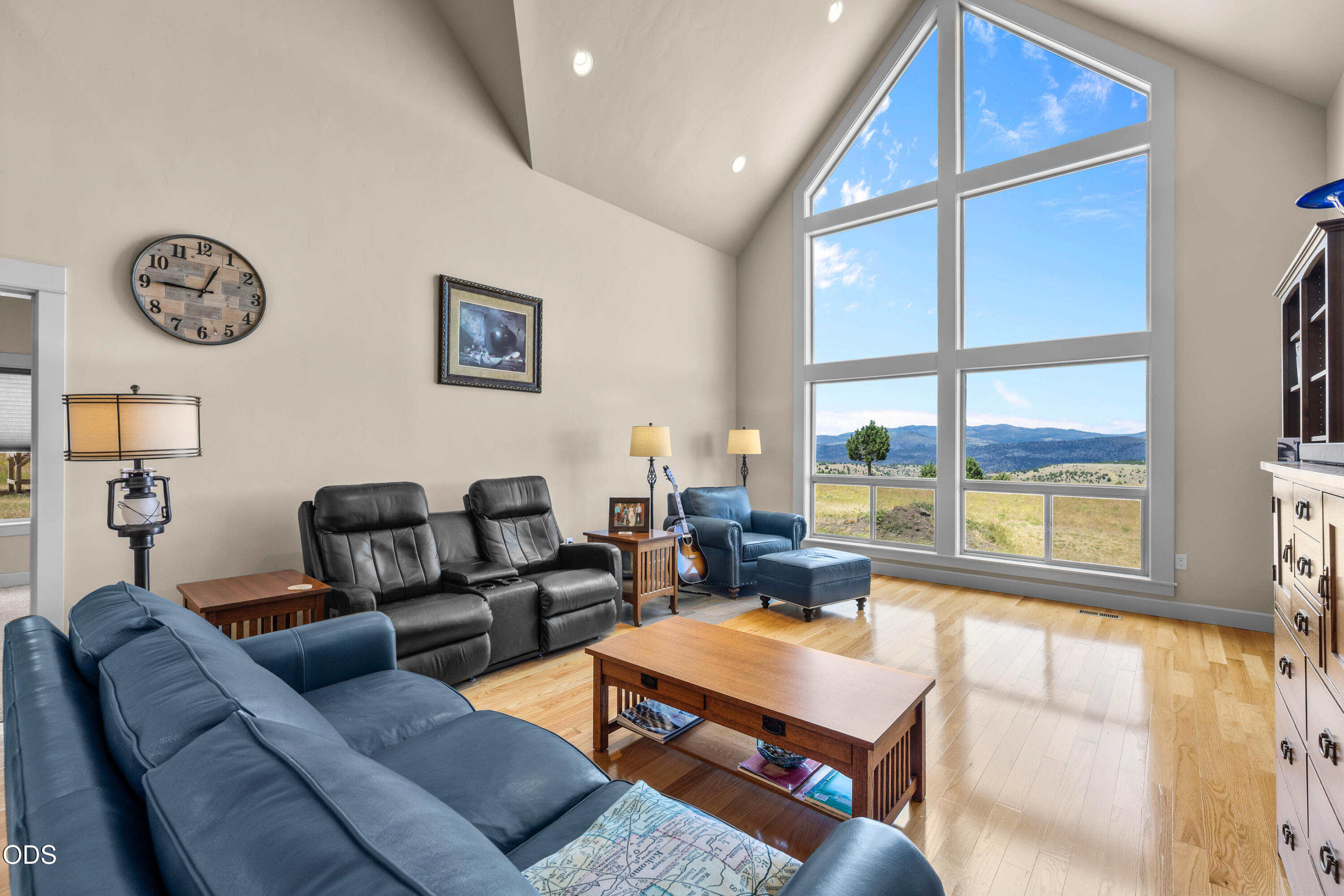 26216 West Bench Road John Day, OR 97845 - Photo 11 of 53 a living room with furniture a large window and a clock