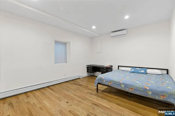 a view of a room with wooden floor