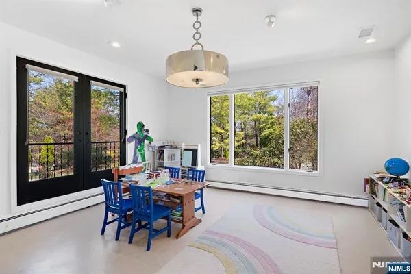 a view of a dining room with furniture window and outside view