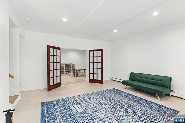 a living room with furniture and a rug