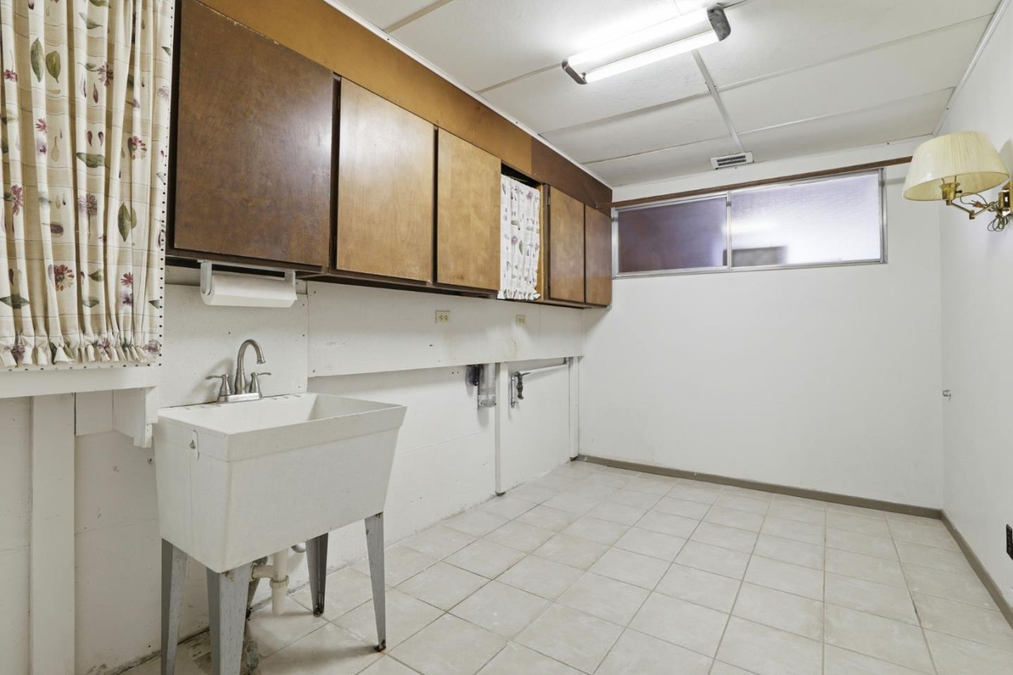 208 Mill Creek Road Fremont, CA 94539 - Photo 30 of 59 a kitchen with a sink cabinets and window