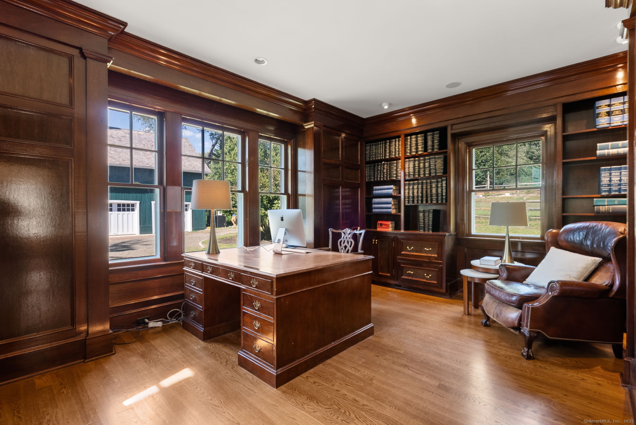 221 Greens Farms Road Westport, CT 06880 - Photo 18 of 39 a living room with furniture a flat screen tv and a floor to ceiling window