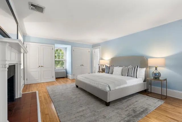 a bedroom with a bed and a couch