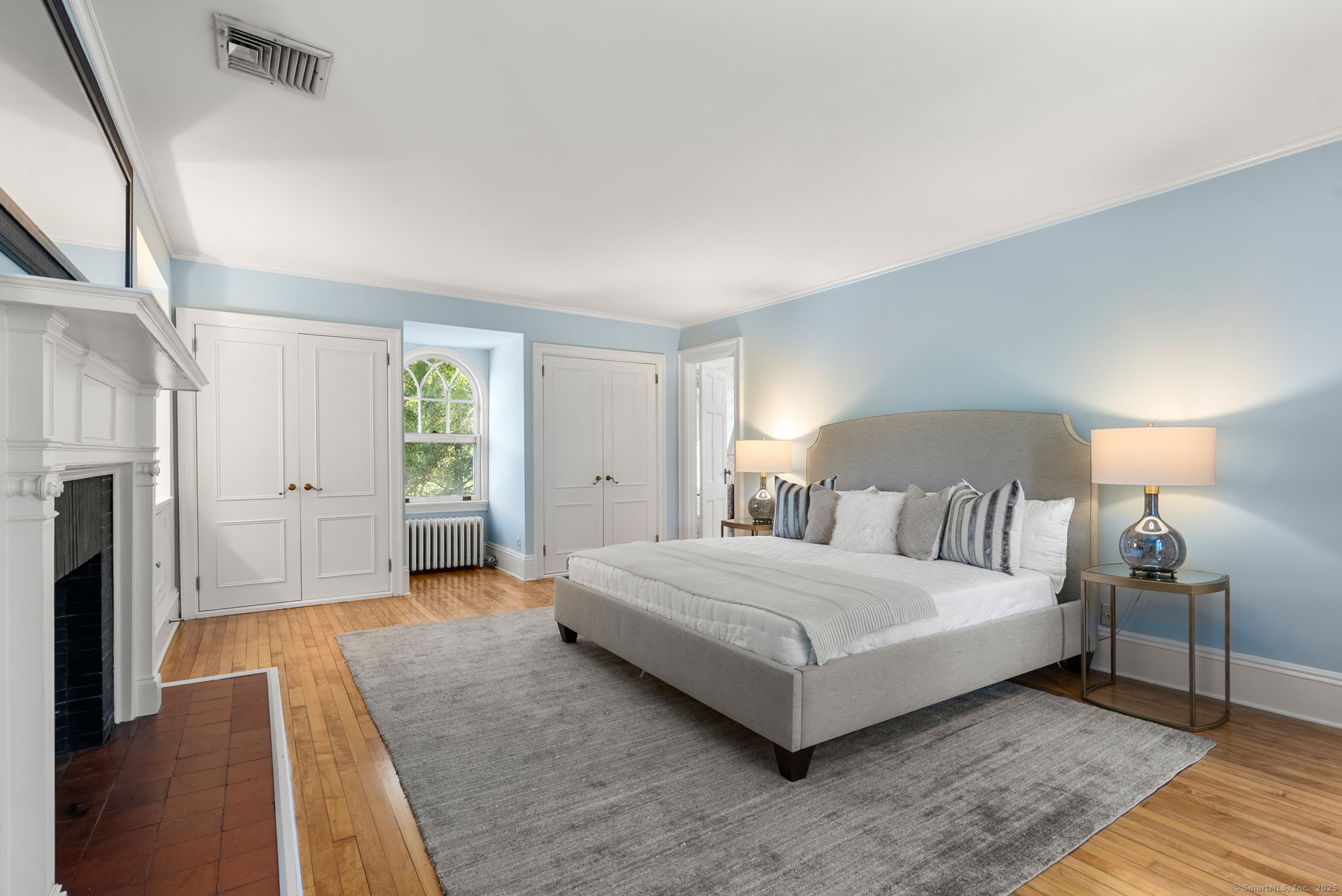 221 Greens Farms Road Westport, CT 06880 - Photo 20 of 39 a bedroom with a bed and a couch