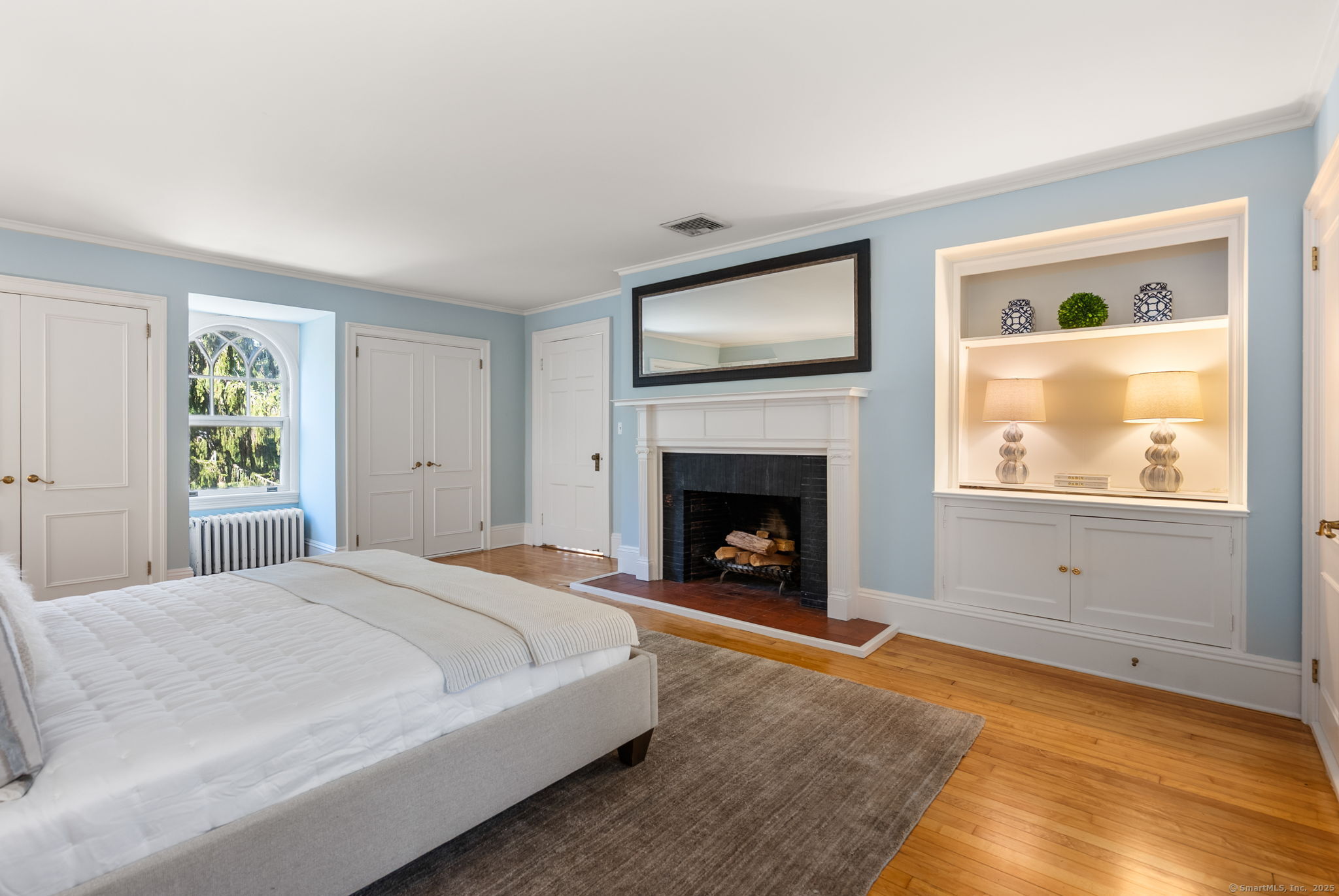 221 Greens Farms Road Westport, CT 06880 - Photo 21 of 39 a bedroom with a bed and a fireplace