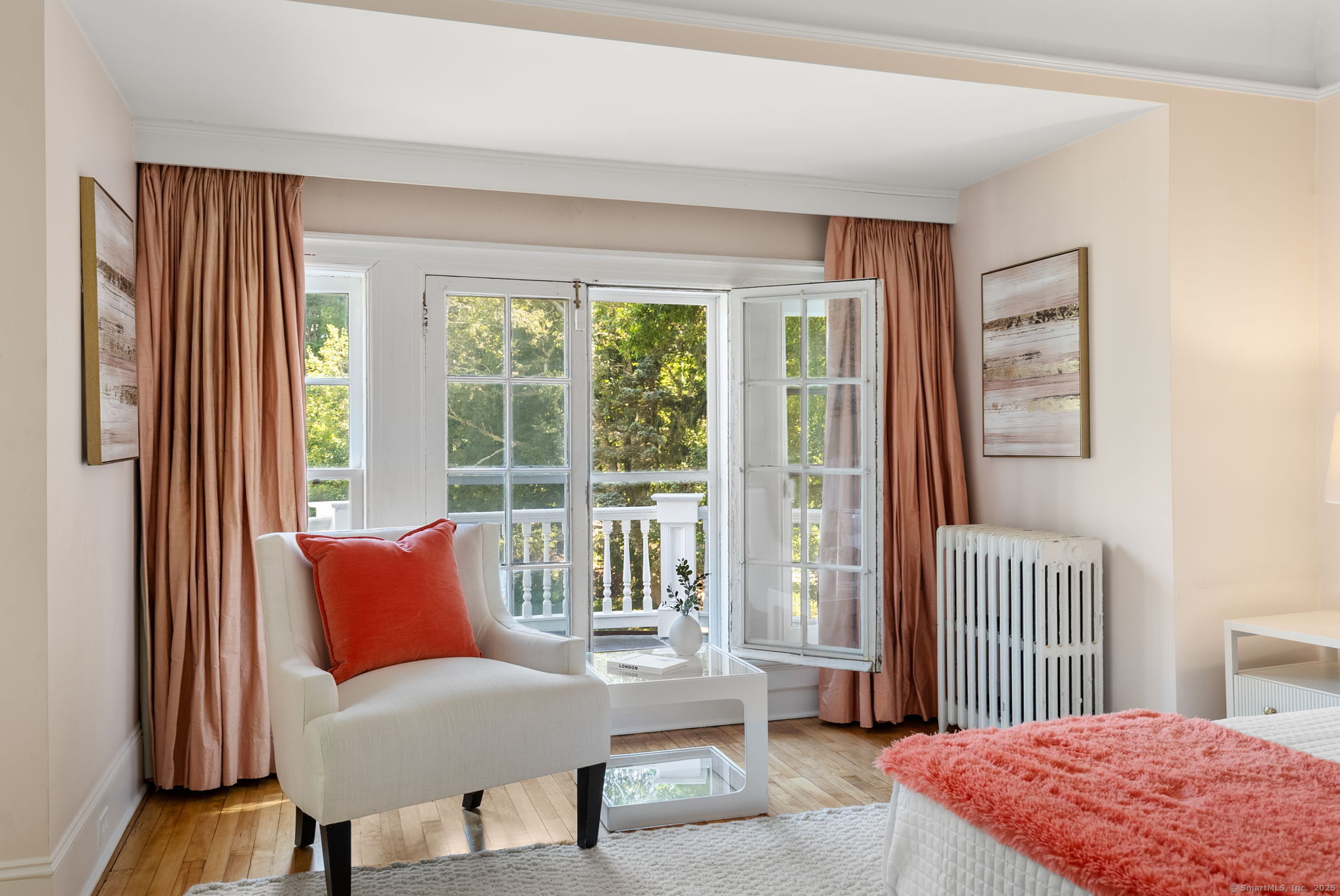 221 Greens Farms Road Westport, CT 06880 - Photo 25 of 39 a bedroom with a balcony a bed and a chair