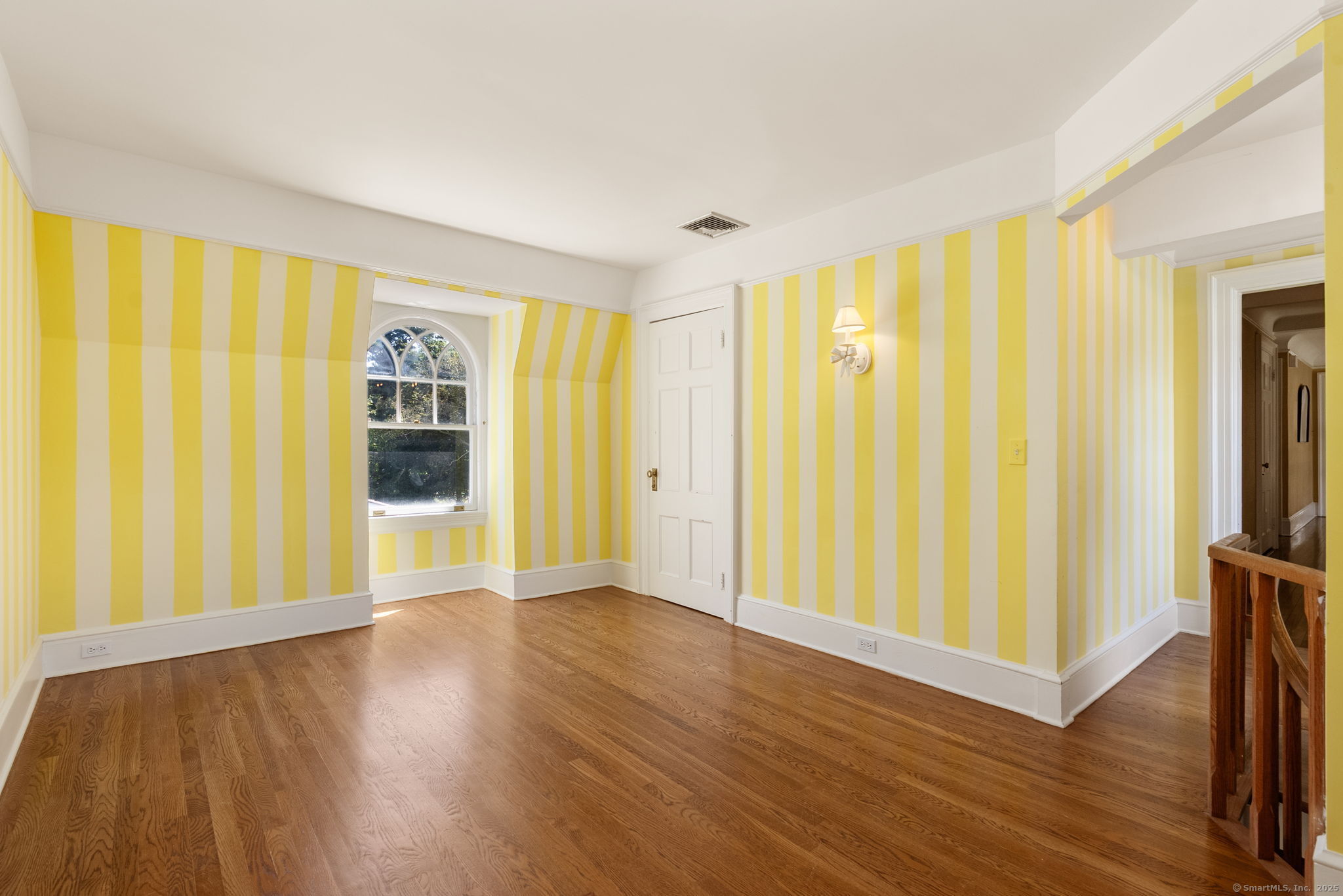 221 Greens Farms Road Westport, CT 06880 - Photo 28 of 39 a view of an empty room with wooden floor and a window