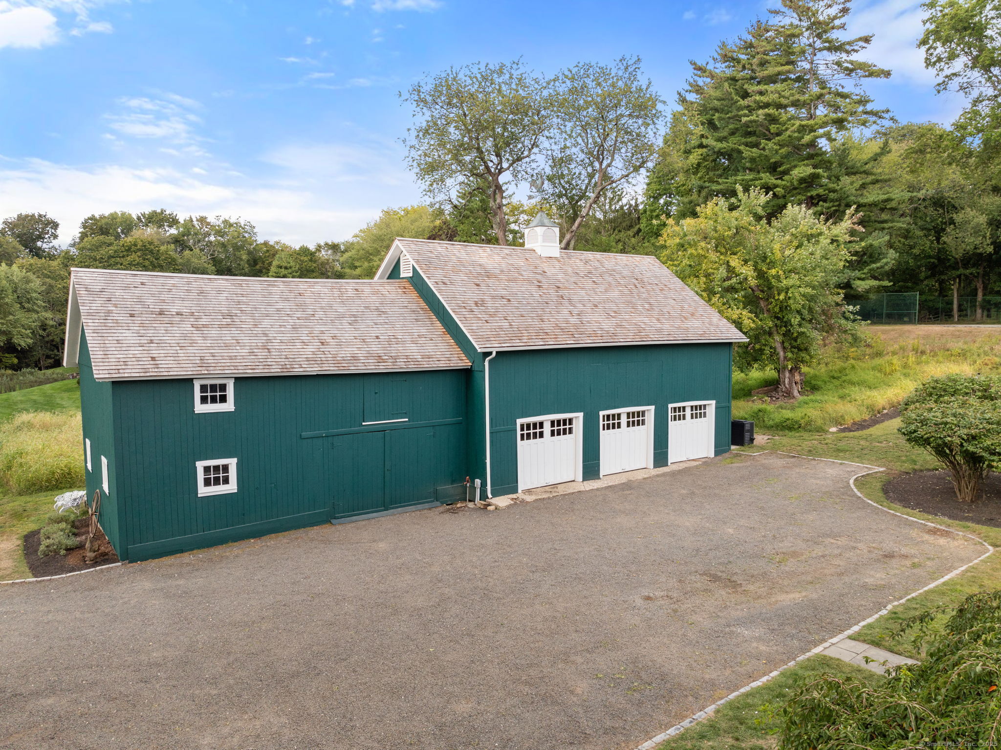 221 Greens Farms Road Westport, CT 06880 - Photo 35 of 39 a front view of a house with a yard