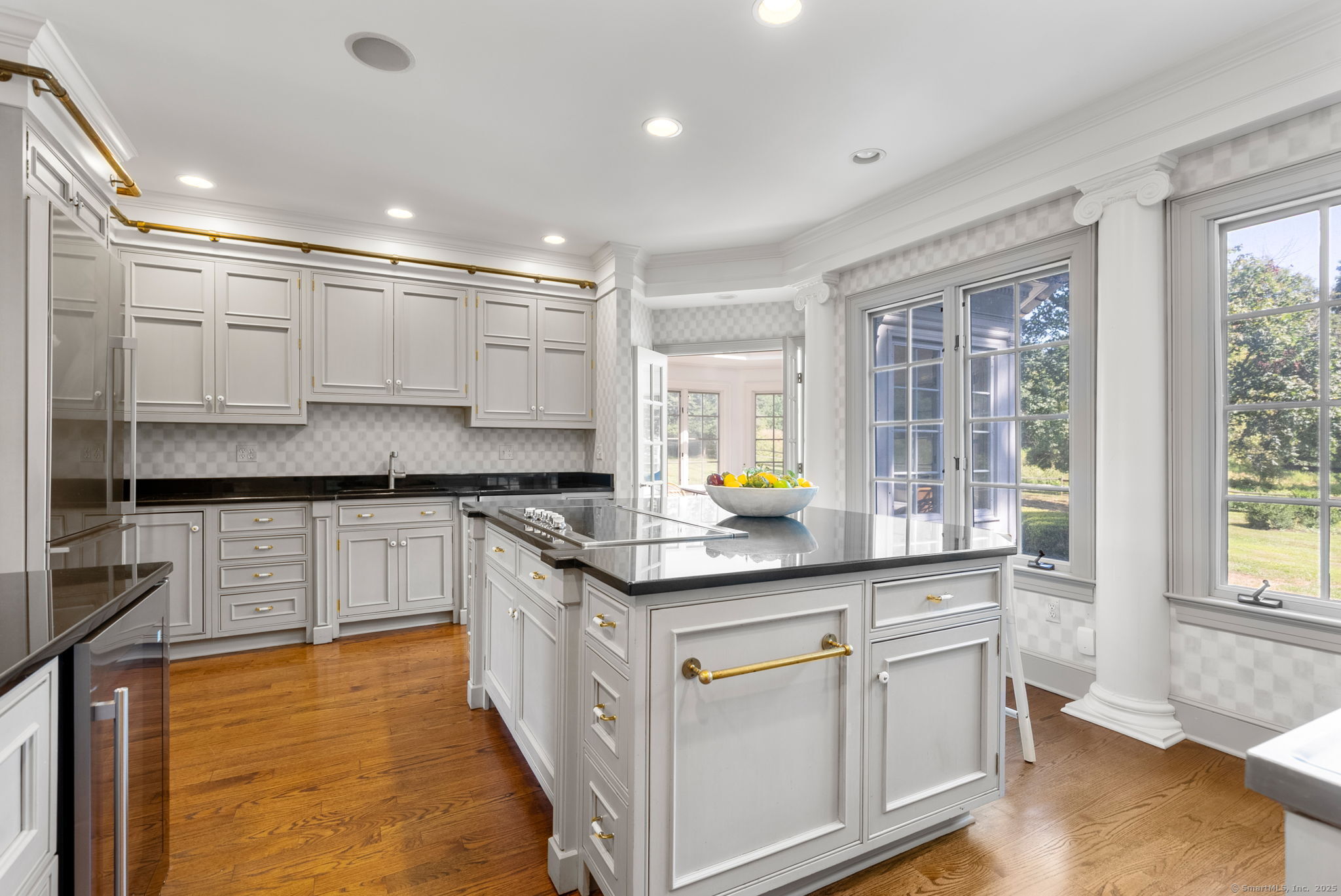 221 Greens Farms Road Westport, CT 06880 - Photo 9 of 39 a kitchen with stainless steel appliances granite countertop a sink and cabinets
