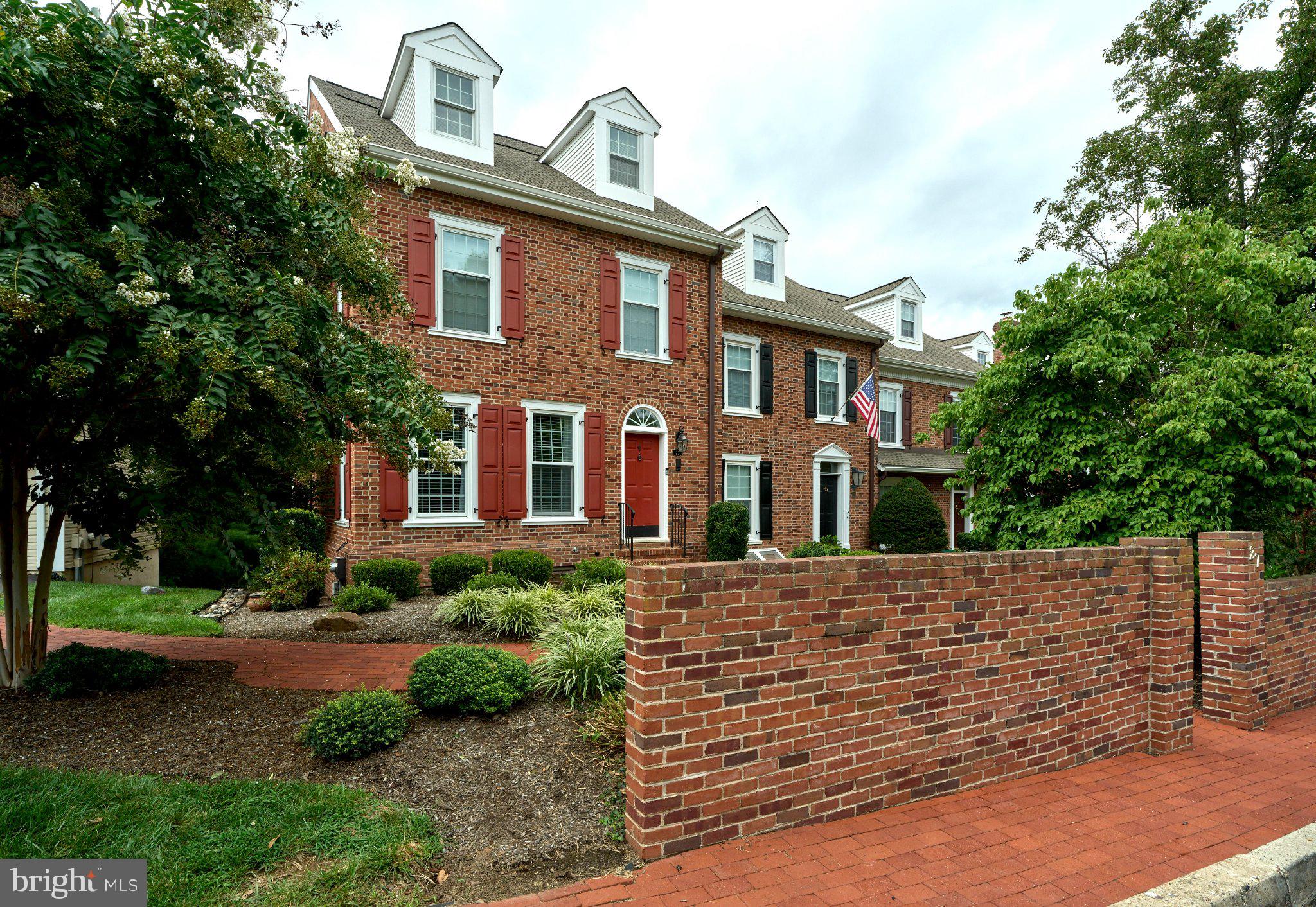 27 Sentinel Road, Unit 139 Washington Crossing, PA 18977 - Photo 2 of 37 Charming brick home with lush greenery.