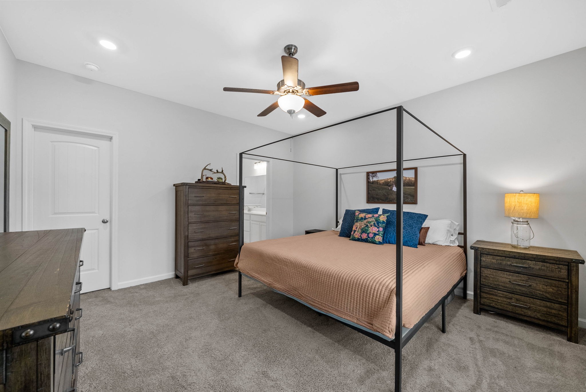 315 Windyhill Street Murfreesboro, TN 37129 - Photo 15 of 38 a bedroom with a bed a dresser and a chandelier