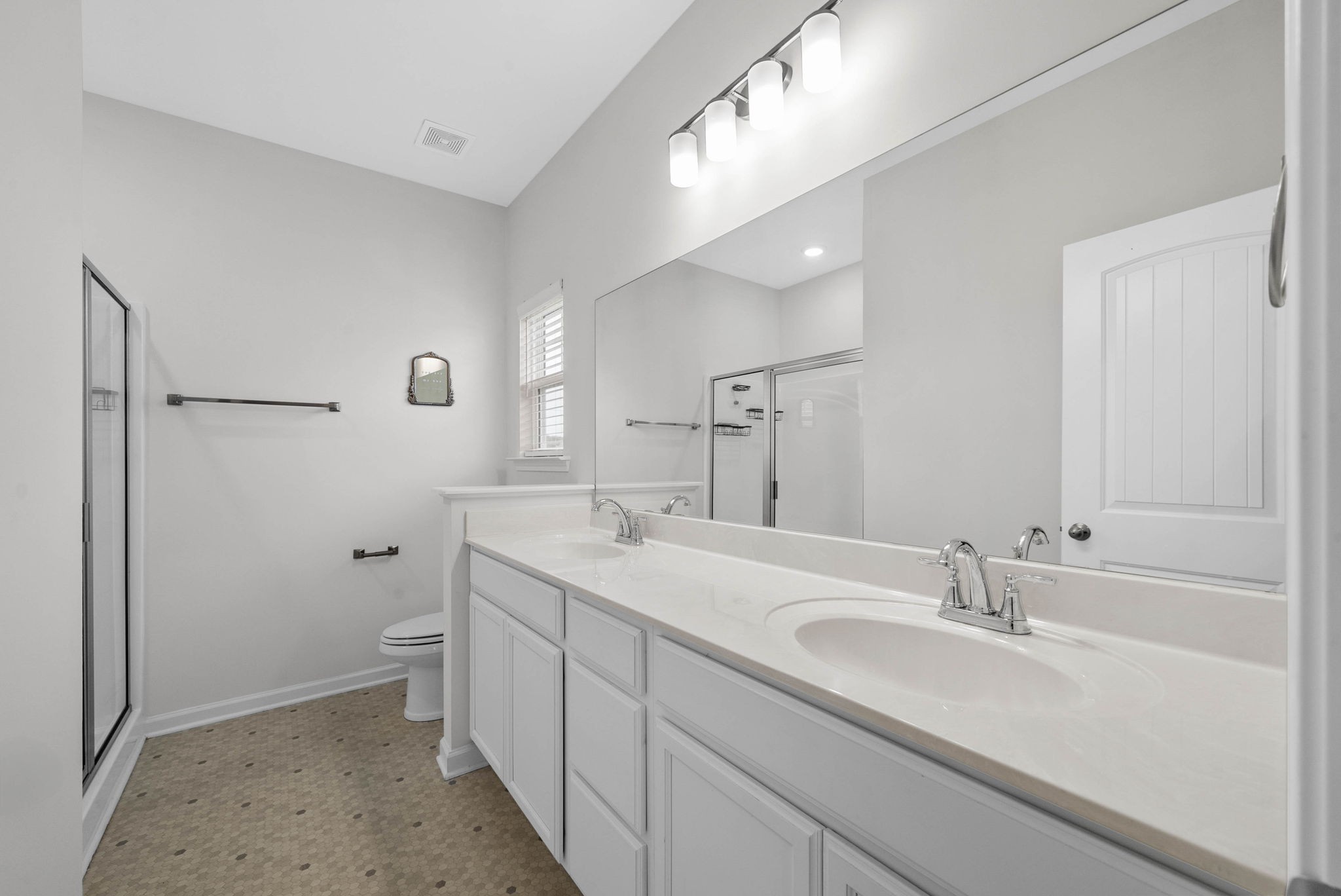 315 Windyhill Street Murfreesboro, TN 37129 - Photo 17 of 38 a bathroom with a double vanity sink toilet and a mirror