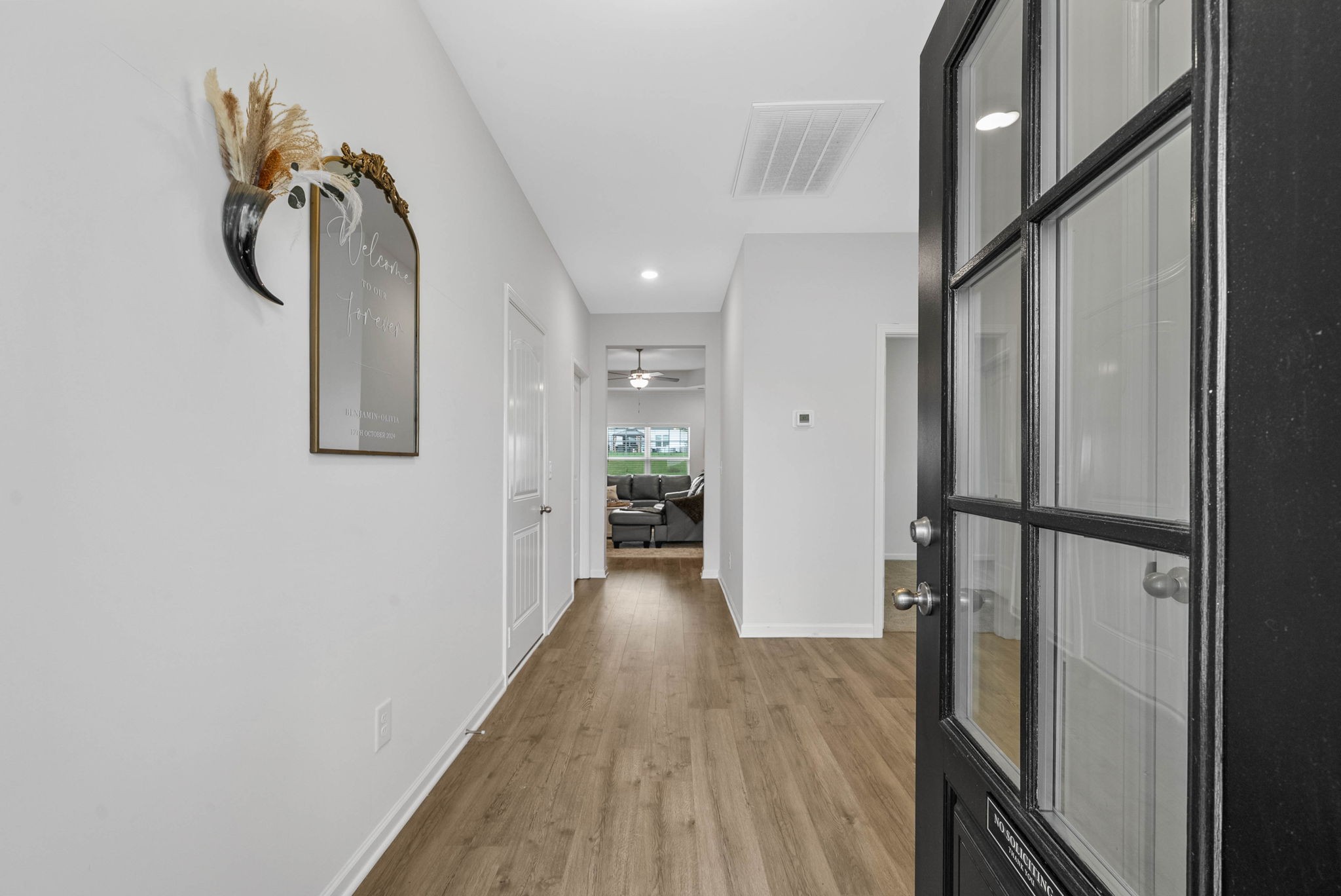 315 Windyhill Street Murfreesboro, TN 37129 - Photo 5 of 38 a view of a hallway with wooden floor and staircase