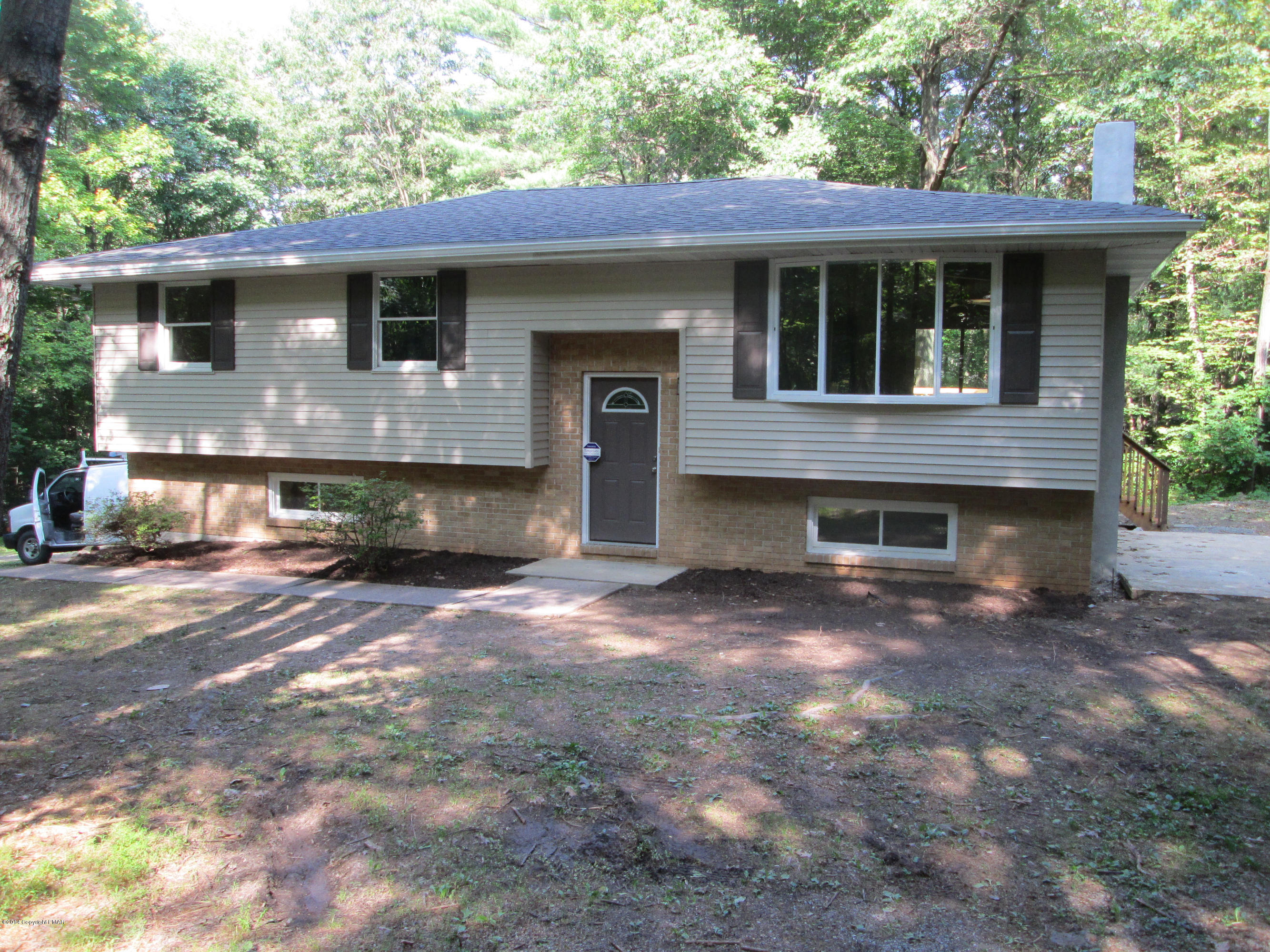 1504 Astolat Road Effort, PA 18330 - Photo 1 of 15 a front view of a house with a yard