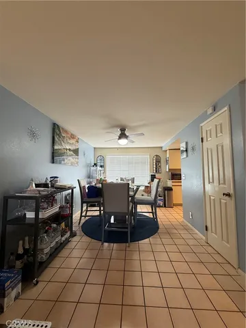 a open kitchen with stainless steel appliances granite countertop a stove and a refrigerator