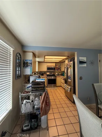 a bedroom with furniture and a flat screen tv