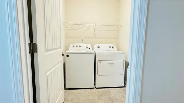 a utility room with dryer and washer