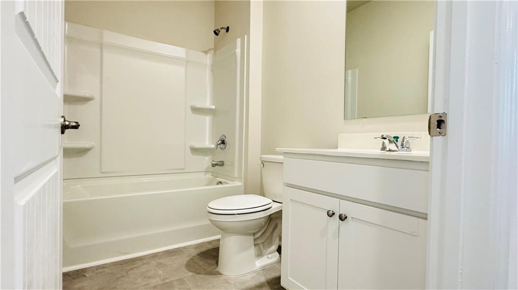 5114 Tulip Square Acworth, GA 30101 - Photo 13 of 36 a bathroom with a sink toilet and shower